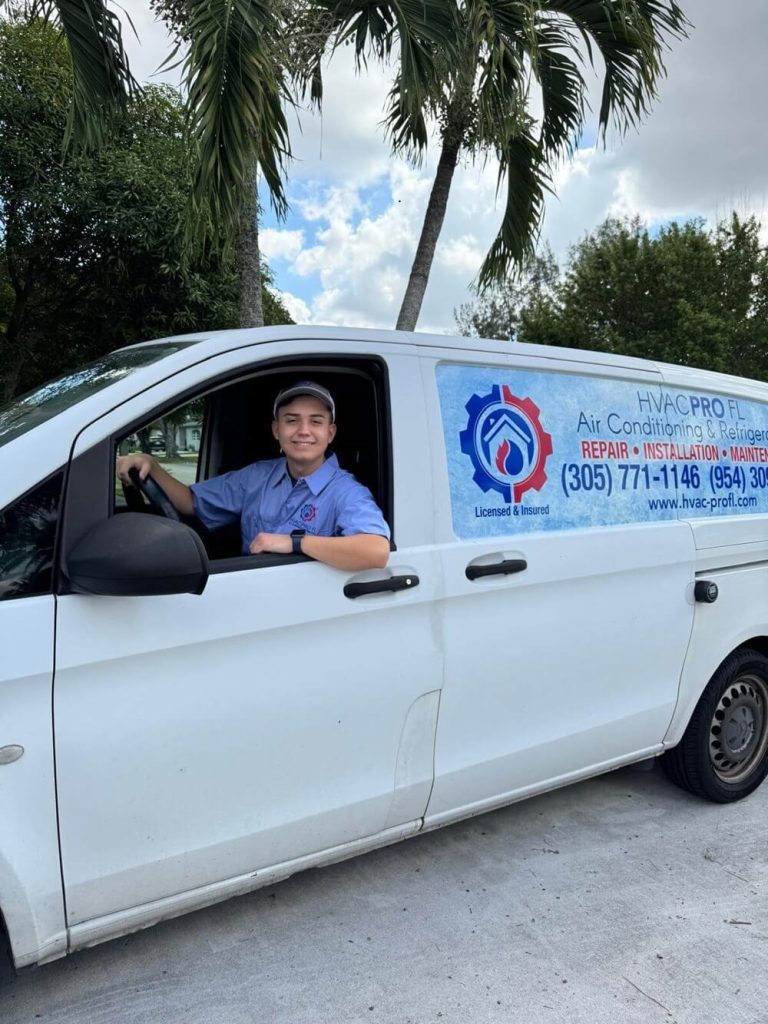 HVAC technician in service van providing AC installation and financing services in South Florida